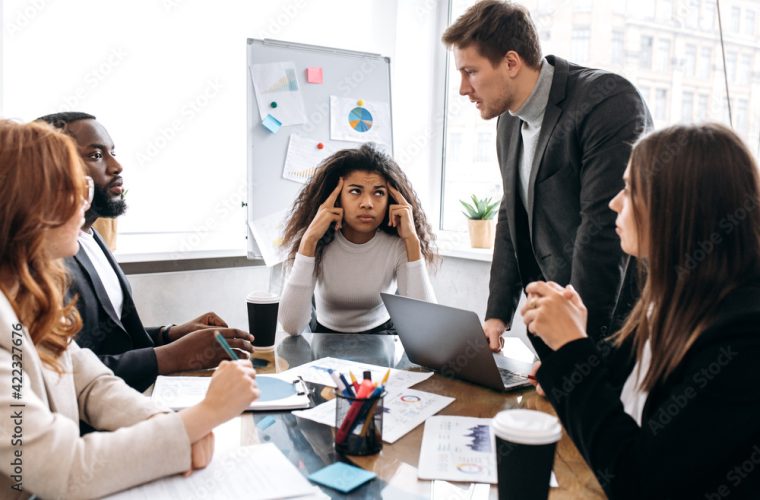 office meeting around a table with many employees