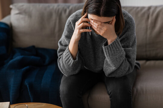 an upset woman talking on the phone