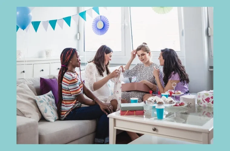 women at a baby shower opening gifts