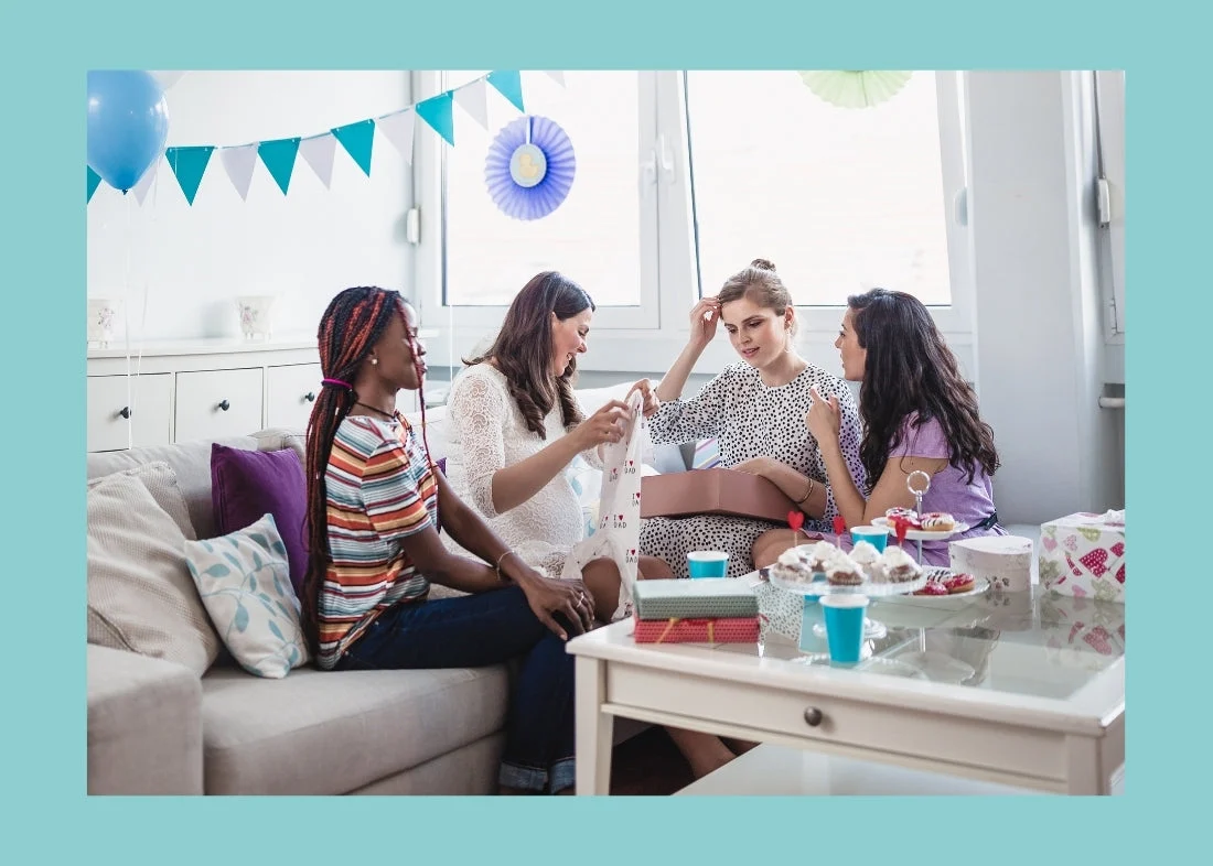 women at a baby shower opening gifts