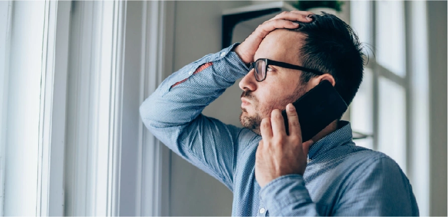 worried man talking of the phone