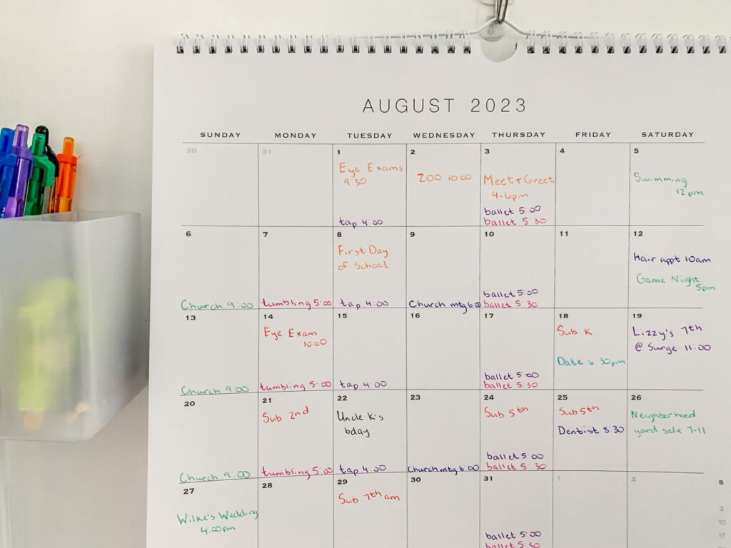 colour coded paper calendar filled with tasks