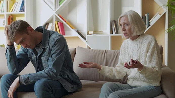 woman and man arguing on a sofa