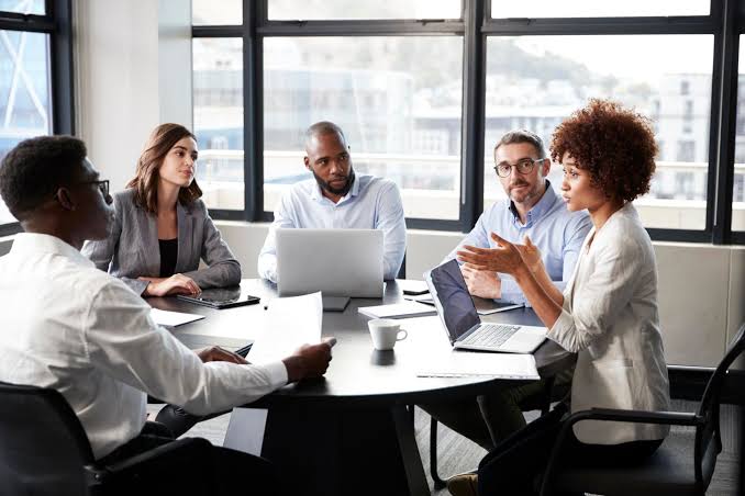 people talking at an office m eeting