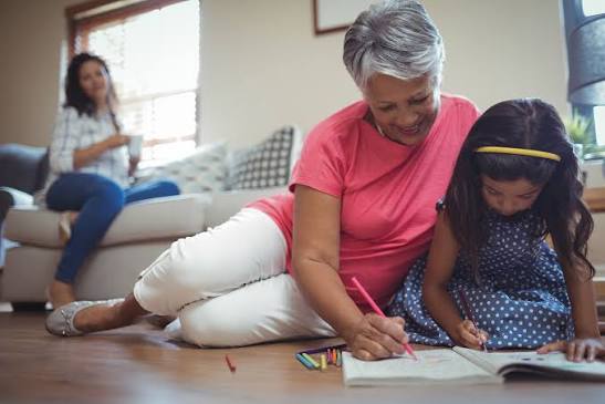 grandma playing with her granddaughter