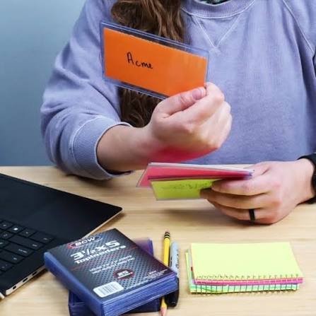 woman holding notes in the hands and looking at one