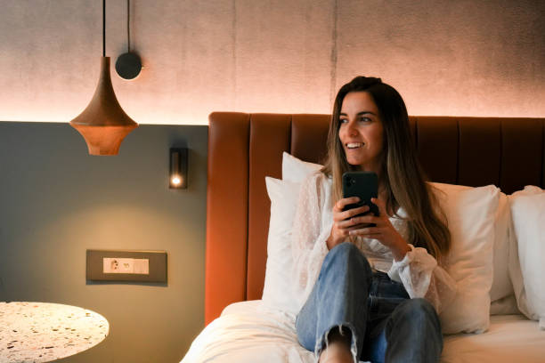 happy woman in a hotel room