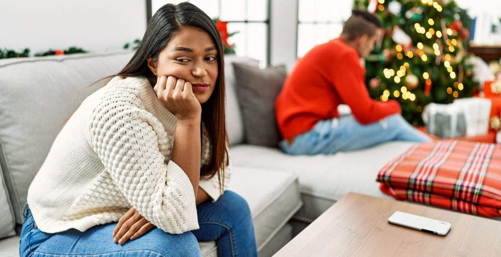 annoyed woman sitting on a sofa